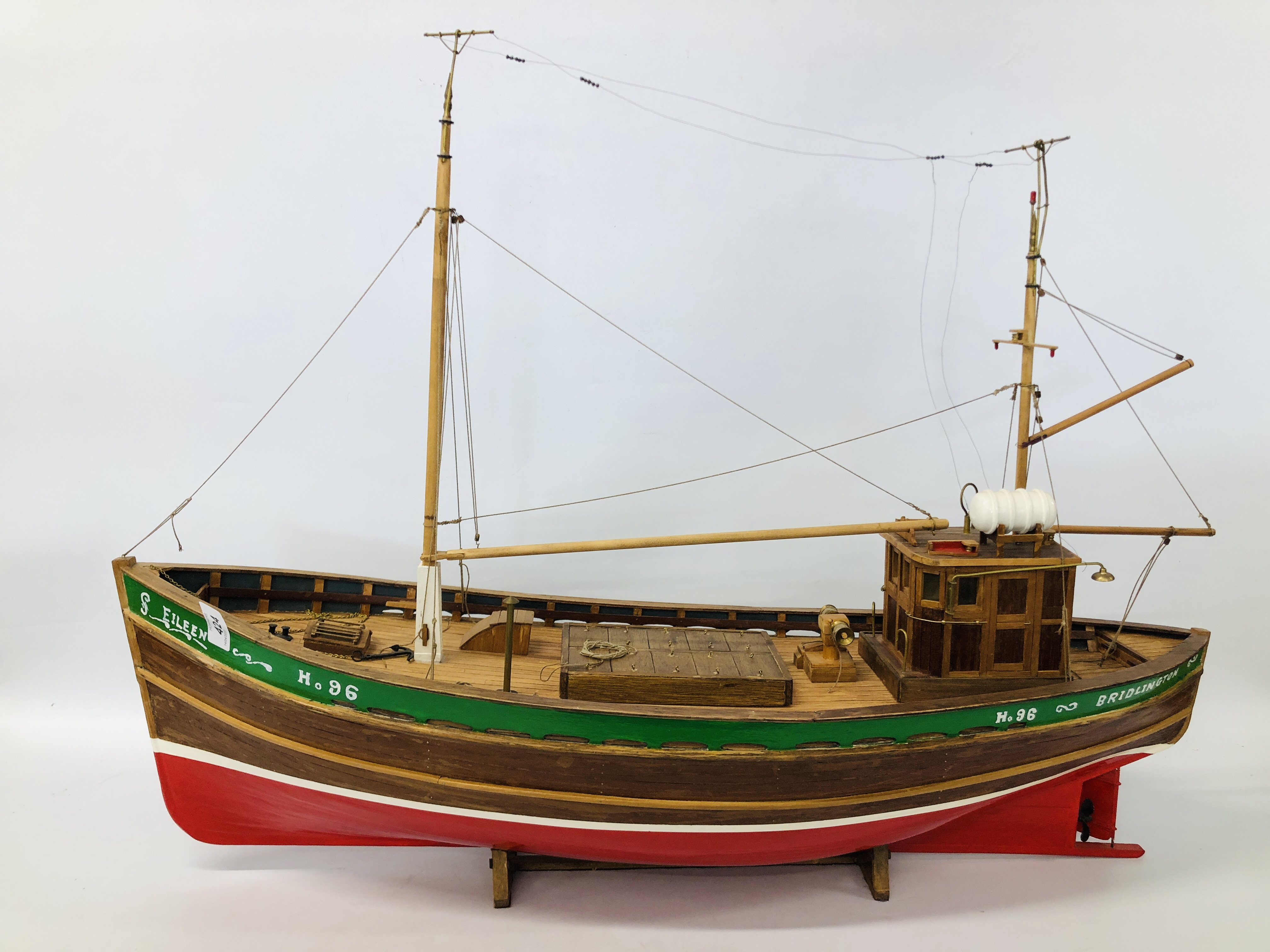 A VINTAGE HAND BUILT WOODEN MODEL OF A FISHING TRAWLER "EILEEN" NO. 96 LENGTH 85CM. HEIGHT 66CM.