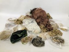 A BOX OF ASSORTED HAIR PIECES