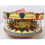 A VINTAGE HANDCRAFTED WOODEN MODEL OF A FAIRGROUND CAROUSEL WITH MOTORISED ACTION AND LIGHTS -