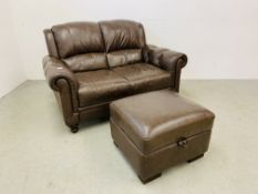 A DARK TAN LEATHER 2 SEATER SOFA WITH MATCHING FOOTSTOOL.