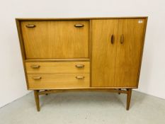 A G-PLAN EGOMME COMBINATION TEAK SIDEBOARD WIDTH 130CM. DEPTH 44CM. HEIGHT 112CM.