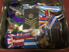 TIN OF MEDALS, RIBBONS, SUSPENDERS, BUTTONS AND BADGES ETC.