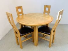 A CIRCULAR EXTENDING SOLID LIGHT OAK DINING TABLE AND FOUR SOLID LIGHT OAK DINING CHAIRS WITH FAUX