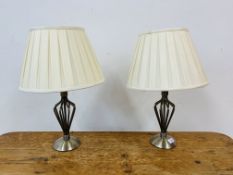 A PAIR OF MODERN DESIGNER OPEN METALCRAFT TABLE LAMPS WITH CREAM PLEATED SHADES - SOLD AS SEEN.