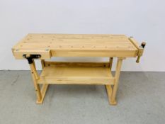 AN AS NEW BEECHWOOD CARPENTRY BENCH FITTED WITH TWO VICES LENGTH 135CM.