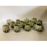 A COLLECTION OF 12 PIECES OF HOLKHAM POTTERY IN THE SNOW DROP DESIGN TO INCLUDE 9 COFFEE MUGS,