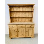 A STRIPPED PINE THREE DRAWER THREE DOOR FARMHOUSE DRESSER WITH BARLEY TWIST UPSTAND SUPPORTS W