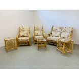 A FOUR PIECE CANE CONSERVATORY SUITE WITH CREAM PATTERNED CUSHIONS - COMPRISING OF TWO SEATER,