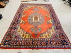 A GOOD QUALITY RED / BLUE PATTERNED EASTERN CARPET 3.3M X 2.2M.