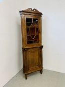 AN ANTIQUE OAK HALF GLAZED FLOOR STANDING CORNER CUPBOARD WIDTH 77CM. HEIGHT 209CM.