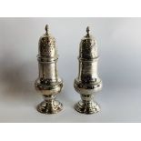 A PAIR OF GOOD QUALITY SILVER SIFTERS HEIGHT 13.5CM.