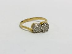 18CT GOLD (RUBBED MARKS) DIAMOND CROSS OVER STYLE RING SET WITH TWO FLOWER HEAD SETTING EACH HAVING