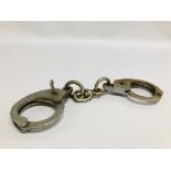 PAIR OF VINTAGE BRITISH MADE HANDCUFFS "HIATTS 1960" - WE CANNOT GUARANTEE THE ORIGINALITY OF THESE