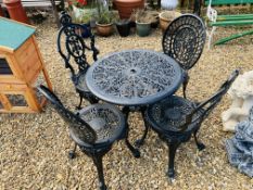 A DECORATIVE CAST ALUMINIUM PATIO TABLE AND FOUR CHAIRS - TABLE DIA. 70CM.