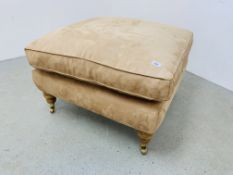 A LARGE LIGHT TAN SUEDE UPHOLSTERED FOOTSTOOL