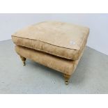 A LARGE LIGHT TAN SUEDE UPHOLSTERED FOOTSTOOL