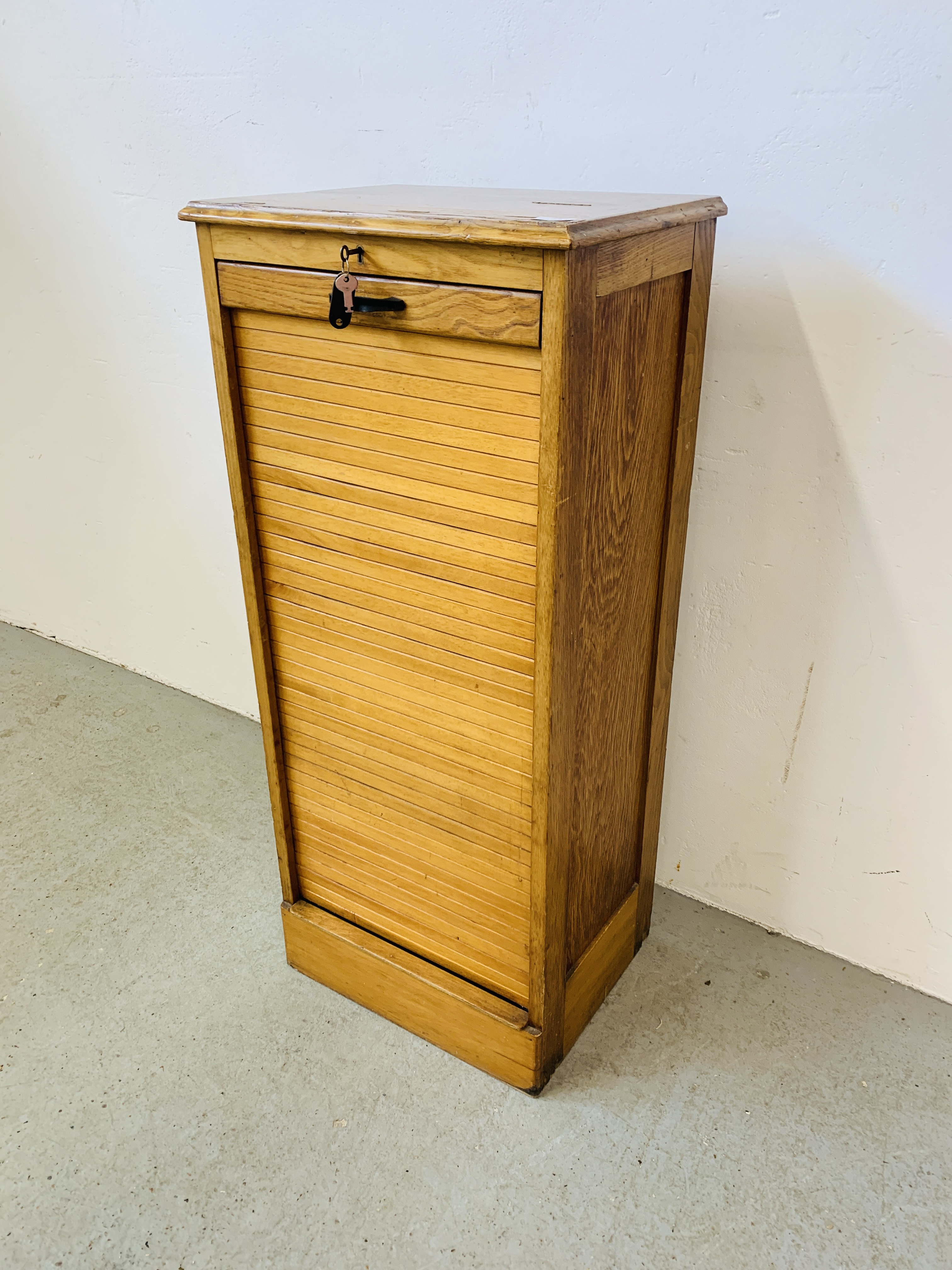 A VINTAGE HARDWOOD TAMBOUR FRONT MULTI DRAWER FILING CABINET W 48CM, D 36CM, H 111CM.