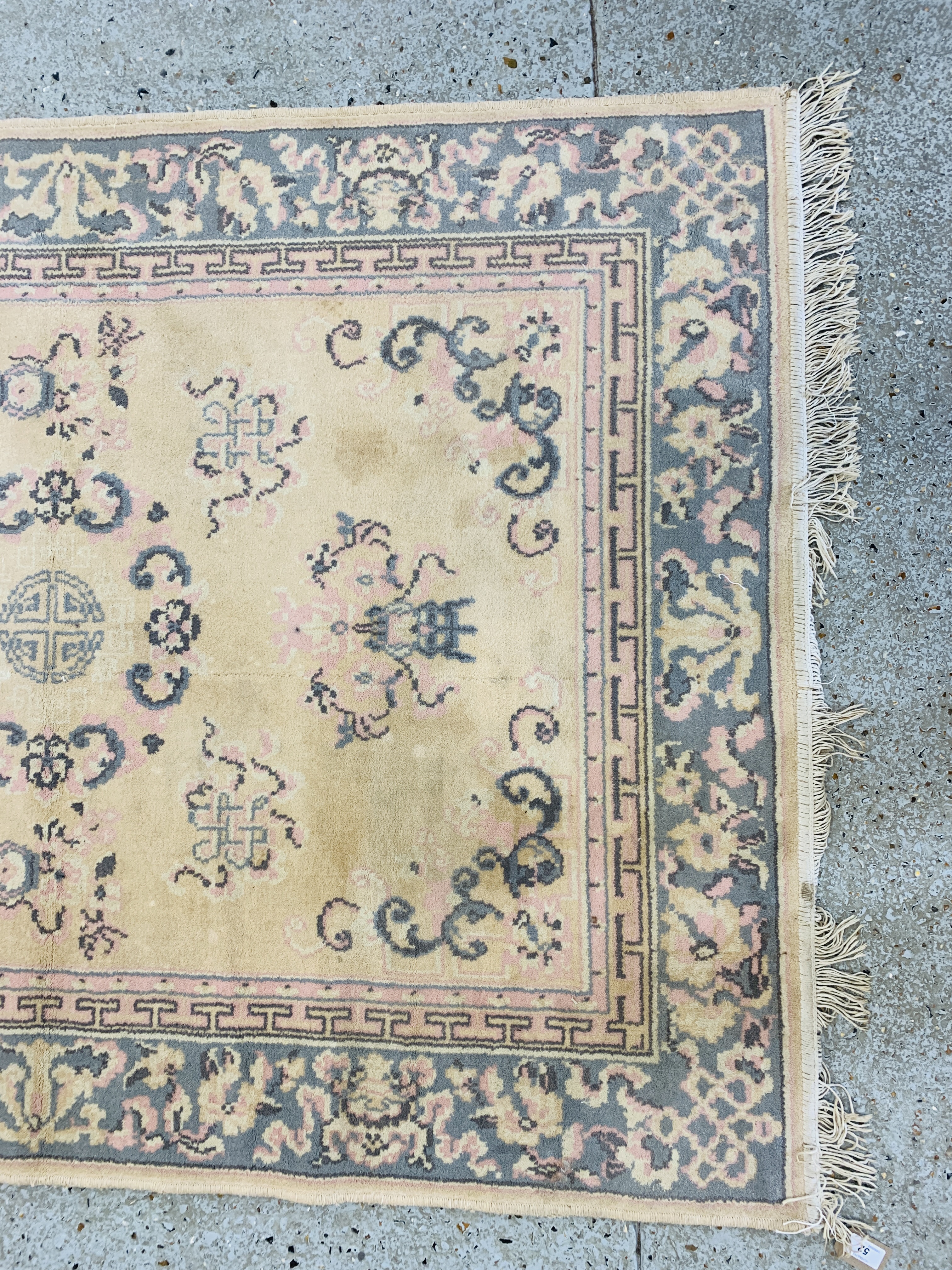 A CHINESE RUG BLUE / PINK PATTERNED ON BEIGE GROUND 1.7M X 1.25M. - Image 2 of 4
