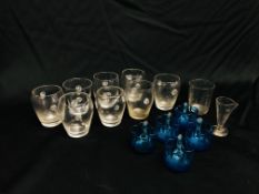 SEVEN GLASS BARREL SHAPED TUMBLERS WITH FLOWER HEAD HANDLES HEIGHT 6.5CM.