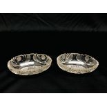 A PAIR OF LATE GEORGIAN OVAL CUT GLASS DISHES, SOME CHIPS, L 12.5CM.