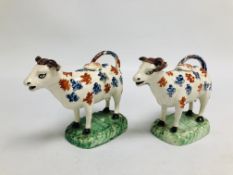 A PAIR OF SWANSEA POTTERY COW CREAMERS AND COVERS c.1800, L 18.