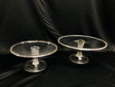 TWO GEORGIAN CIRCULAR GLASS TAZZA'S, THE FLUTED COLUMN ON A BASE WITH FOLDED FOOT, D 28CM AND 35.