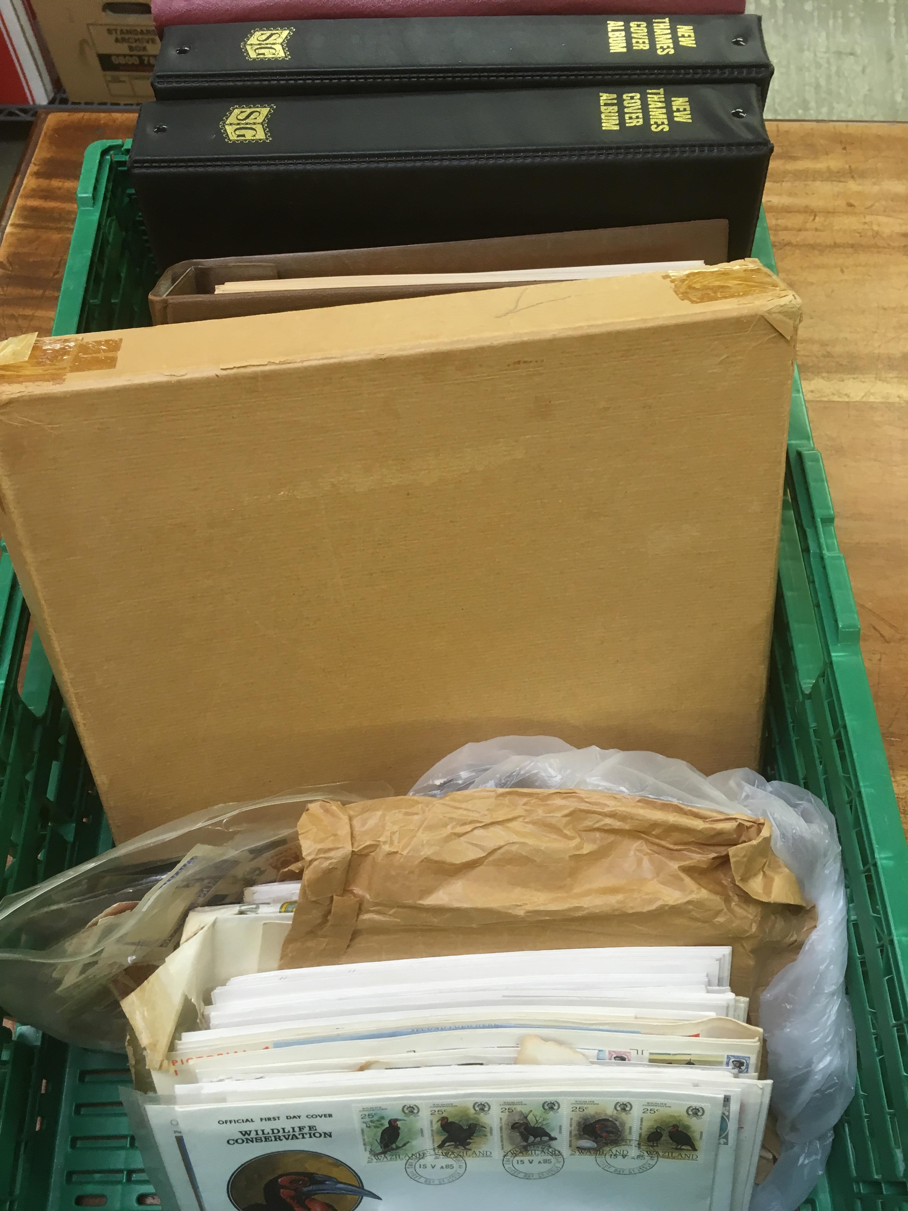 CRATE WITH STAMPS AND FIRST DAY COVERS IN FIVE ALBUMS AND LOOSE