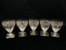 FIVE LATE GEORGIAN ALE GLASSES ENGRAVED WITH A FRUITING VINE, ON A SQUARE BASE HEIGHT 13CM.