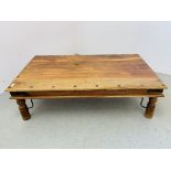 RUSTIC HARDWOOD COFFEE TABLE, STUD AND METAL WORK DETAIL LENGTH 135CM. WIDTH 75CM. HEIGHT 40CM.