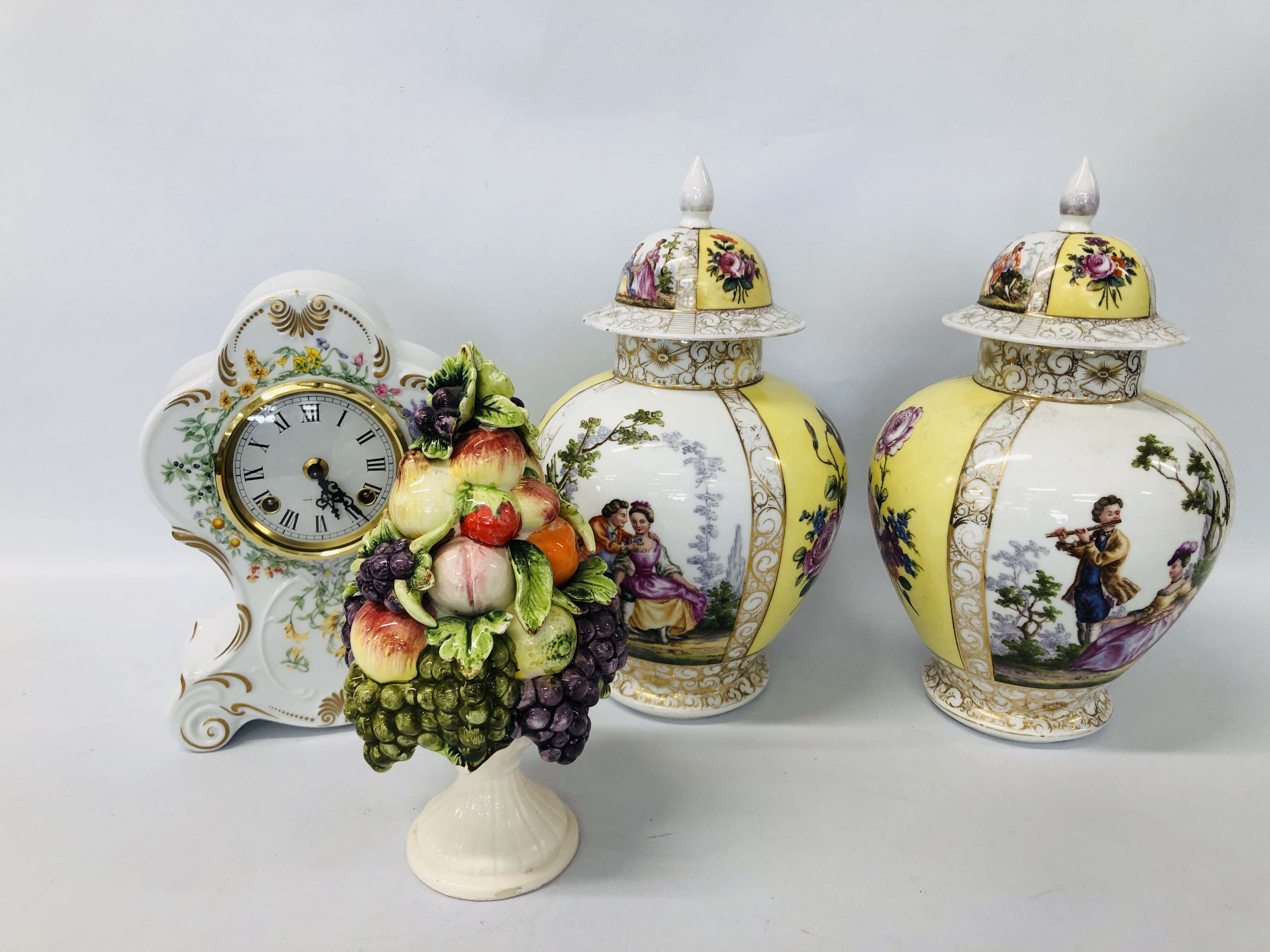 PAIR OF DECORATIVE CONTINENTAL LIDDED URNS, DECORATED WITH CLASSICAL FIGURES AND FLOWER,