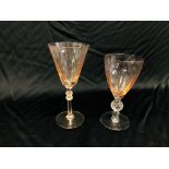 TWO FACETED GLASSES, THE BOWL TINTED PINK, THE STEM WITH HOBNAIL CUT KNOP, 17CM.