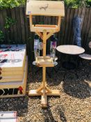 LOCAL HAND MADE BIRD TABLE ALONG WITH TWO BIRD FEEDERS.