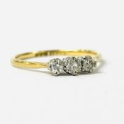 18CT. GOLD THREE STONE DIAMOND RING.