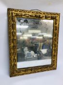 AN C18th GILT PICTURE FRAME, NOW WITH A MODERN MIRROR PLATE.