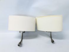 A PAIR OF WALL MOUNTED BEDSIDE LAMPS WITH READING LIGHTS AND SHADES