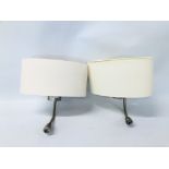 A PAIR OF WALL MOUNTED BEDSIDE LAMPS WITH READING LIGHTS AND SHADES