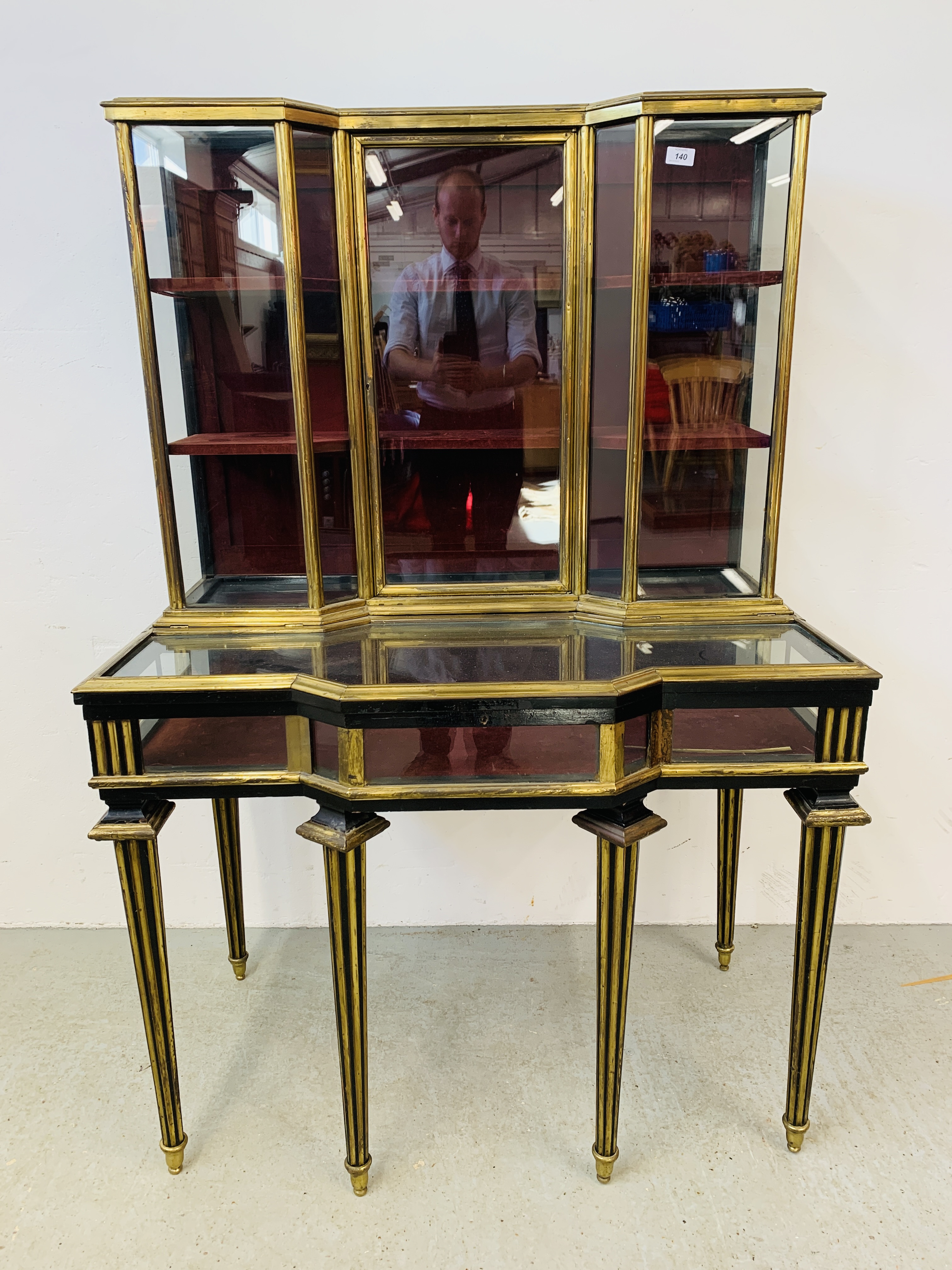 A C19th FRENCH BRASS AND EBONISED CABINET, THE TOP AND SIDES GLAZED,