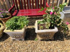 A PAIR OF STONEWORK SQUARE GARDEN PLANTERS WITH DECORATIVE SCENE.