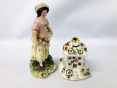 A STAFFORDSHIRE FIGURE OF A GIRL WITH A BASKET OF FLOWERS,