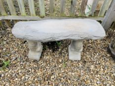 A STONEWORK GARDEN BENCH SUPPORTED BY SQUIRRELS LENGTH 100CM.
