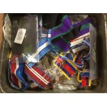 TIN OF MEDALS, RIBBONS, SUSPENDERS, BUTTONS AND BADGES, ETC.