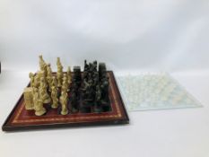 TWO CHESS SETS TO INCLUDE ONE GLASS.