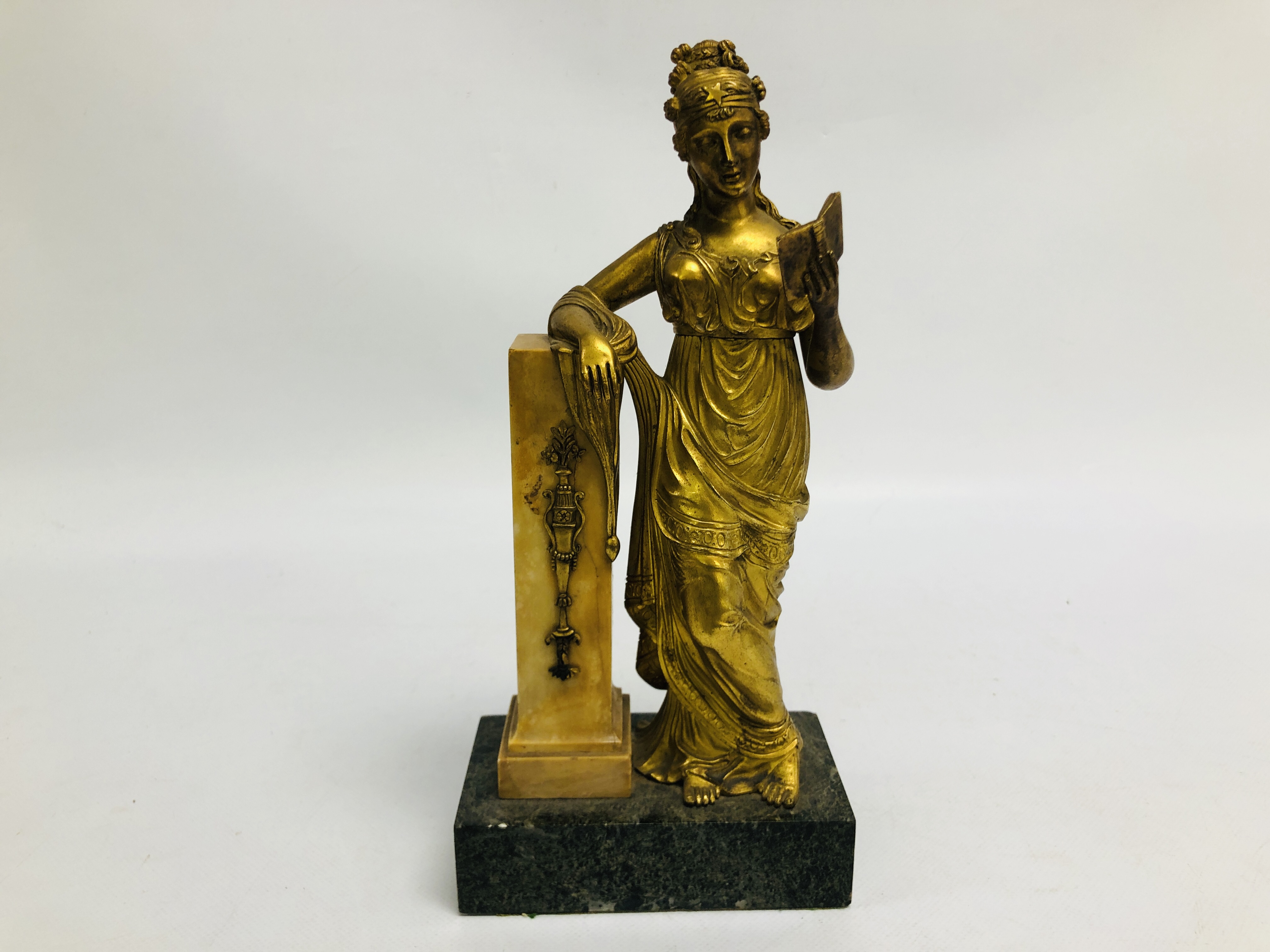 A BELLE EPOQUE GILT BRONZE FIGURE OF A STANDING WOMAN IN CLASSICAL DRESS, READING FROM A BOOK,