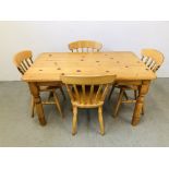 A HONEY PINE DINING TABLE WITH FOUR PINE DINING CHAIRS
