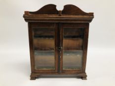 VINTAGE MINIATURE APPRENTICE PIECE IN THE FORM OF A MAHOGANY GLAZED TWO DOOR DISPLAY CABINET HEIGHT