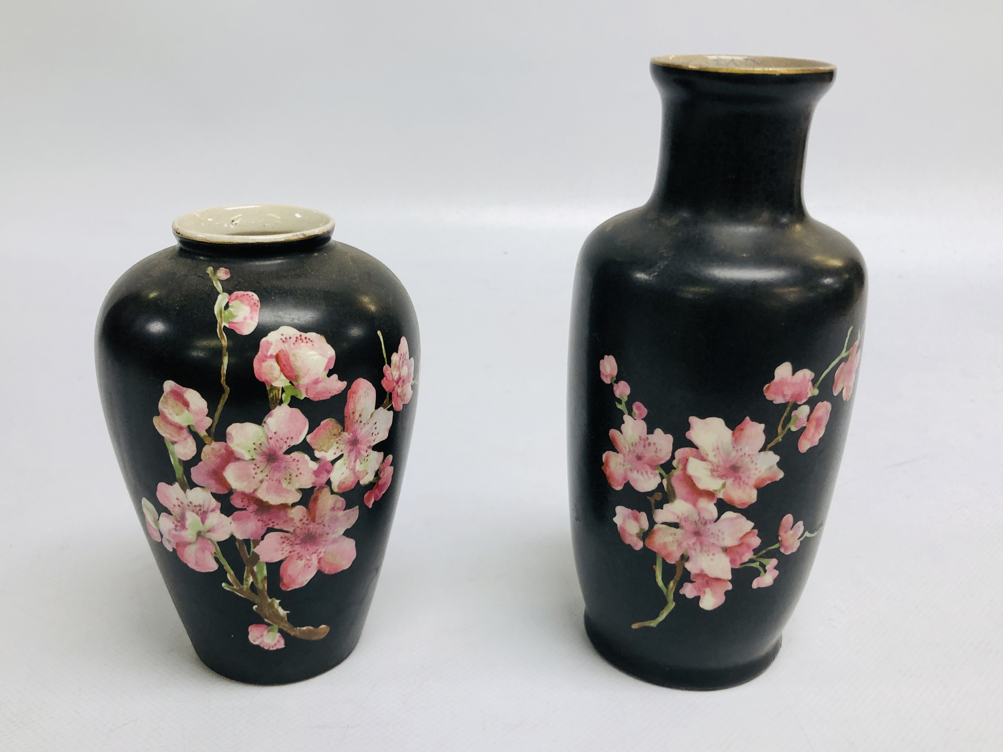 TWO SIMILAR STAFFORDSHIRE VASES DECORATED ON A BLACK GROUND WITH PRUNUS BLOSSOM, c. 1900.