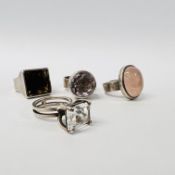 FOUR BESPOKE IRISH SILVER STONE SET DRESS RINGS