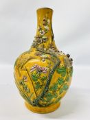 A MAJOLICA BOTTLE VASE, YELLOW GROUND WITH RAISED DECORATION INCLUDING BIRDS AND PRUNUS BLOSSOM.