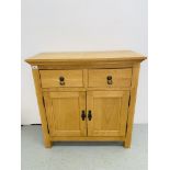 MODERN LIGHT OAK FINISH TWO DRAWER TWO DOOR SIDEBOARD ALONG WITH A BEECH FINISH MAGAZINE RACK.