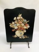 A C19TH EBONISED FIRE-SCREEN, HAVING A DECORATED BAS-RELIEF OF FLOWERS IN A VASE HEIGHT 68.5CM.